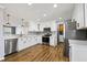 Bright kitchen with white cabinets, stainless steel appliances, hardwood floors, and granite countertops at 333 Walden Lake Rd., Conway, SC 29526
