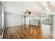 Open-concept living space featuring hardwood floors and a view into the bright kitchen at 333 Walden Lake Rd., Conway, SC 29526