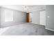Bedroom featuring plush carpeting, large windows, and a sliding barn door to the bathroom at 333 Walden Lake Rd., Conway, SC 29526