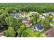 Community aerial view showcasing beautiful homes surrounded by lush greenery and a tranquil pond at 35 Easter Lilly Ct., Murrells Inlet, SC 29576