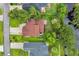 Aerial view of a home showcasing the roof, driveway, and surrounding landscaping at 35 Easter Lilly Ct., Murrells Inlet, SC 29576
