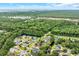 Serene aerial view of a neighborhood nestled amidst lush trees and waterfront scenery, offering tranquility at 35 Easter Lilly Ct., Murrells Inlet, SC 29576