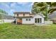 Expansive backyard featuring a well-maintained lawn, patio area, and privacy fence at 35 Easter Lilly Ct., Murrells Inlet, SC 29576