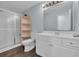 Bright bathroom featuring a shower with glass door, white vanity with a sink and storage at 35 Easter Lilly Ct., Murrells Inlet, SC 29576
