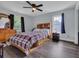 Bedroom with neutral walls, hardwood floors, ceiling fan, and large windows at 35 Easter Lilly Ct., Murrells Inlet, SC 29576
