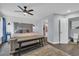 Comfortable bedroom featuring a queen size bed, ensuite bathroom, and a ceiling fan at 35 Easter Lilly Ct., Murrells Inlet, SC 29576