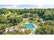 Aerial view of the community pool area with a unique shape, surrounded by lounge chairs and landscaping at 35 Easter Lilly Ct., Murrells Inlet, SC 29576
