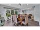 Dining room featuring a wooden table, six upholstered chairs and access to a relaxing living room at 35 Easter Lilly Ct., Murrells Inlet, SC 29576
