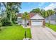 Charming home featuring a well manicured lawn, palm trees, and a two-car garage in a desirable neighborhood at 35 Easter Lilly Ct., Murrells Inlet, SC 29576
