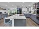 Modern kitchen with two-tone cabinetry, stainless steel appliances, and large island with bar seating at 35 Easter Lilly Ct., Murrells Inlet, SC 29576