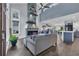 Inviting living room with stone fireplace, high ceilings, large windows, and an open-concept design at 35 Easter Lilly Ct., Murrells Inlet, SC 29576
