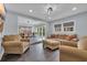 Open concept living and dining area with cozy seating, great natural light, and modern finishes at 35 Easter Lilly Ct., Murrells Inlet, SC 29576