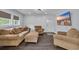 Comfortable living room with a sofa, armchair, TV, and plenty of seating for entertaining at 35 Easter Lilly Ct., Murrells Inlet, SC 29576