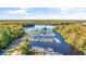 Aerial view of the full-service marina, featuring numerous boat slips and waterfront access at 35 Easter Lilly Ct., Murrells Inlet, SC 29576