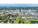 Drone eye view of community near beach with ocean view, green spaces, neighborhood pool, and manicured lawns at 356 Ocean Commons Dr., Surfside Beach, SC 29575