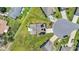 Aerial view of a home featuring solar panels, green lawns, cul-de-sac and nice landscaping at 356 Ocean Commons Dr., Surfside Beach, SC 29575