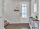 Bright foyer featuring wood floors, a decorative console table, and a stairway at 356 Ocean Commons Dr., Surfside Beach, SC 29575