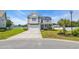 Two-story home featuring gray siding, stone accents, and a well-manicured front yard at 356 Ocean Commons Dr., Surfside Beach, SC 29575