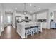 Bright kitchen featuring a large island with seating, stainless steel appliances, and modern pendant lighting at 356 Ocean Commons Dr., Surfside Beach, SC 29575
