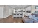 Open-concept kitchen featuring white cabinets, stainless steel appliances, and a center island at 356 Ocean Commons Dr., Surfside Beach, SC 29575