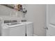 Laundry room with modern washer and dryer, plus storage shelves and room to move around at 356 Ocean Commons Dr., Surfside Beach, SC 29575
