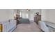 Main bedroom offering generous space, complemented by neutral décor, a ceiling fan, and a desk at 356 Ocean Commons Dr., Surfside Beach, SC 29575