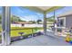 Screened patio that offers outdoor living space, with backyard view and plenty of seating at 356 Ocean Commons Dr., Surfside Beach, SC 29575