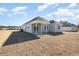 Backyard featuring a covered patio and newly installed sod at 369 Log Cabin Rd., Loris, SC 29569
