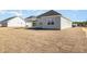Backyard with a covered patio and newly laid sod at 369 Log Cabin Rd., Loris, SC 29569