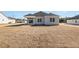 Backyard featuring a covered patio with a ceiling fan and newly laid sod at 369 Log Cabin Rd., Loris, SC 29569