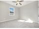 A clean bedroom featuring carpet, a ceiling fan, and a bright window at 369 Log Cabin Rd., Loris, SC 29569
