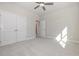 A bedroom featuring carpet, ceiling fan, and closet with double doors at 369 Log Cabin Rd., Loris, SC 29569