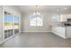 Open-concept dining area with plank flooring and sliding glass door at 369 Log Cabin Rd., Loris, SC 29569