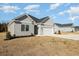 Charming home featuring a two-car garage and minimal landscaping at 369 Log Cabin Rd., Loris, SC 29569
