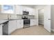 Contemporary kitchen with white cabinets, granite countertops, and stainless steel appliances, plus a pantry at 369 Log Cabin Rd., Loris, SC 29569
