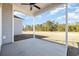 Covered patio with a ceiling fan and view of the backyard and woods at 369 Log Cabin Rd., Loris, SC 29569