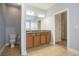 Bathroom with tile floors, wood cabinets, granite counters, dual sinks, and plenty of light at 380 Babylon Pine Dr., Myrtle Beach, SC 29579