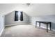 Attic bedroom with sloping ceilings, carpeted floors, a small table, and a window with curtains at 380 Babylon Pine Dr., Myrtle Beach, SC 29579