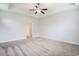 Bedroom featuring neutral carpeting, ample natural light, and a ceiling fan, with an open doorway at 380 Babylon Pine Dr., Myrtle Beach, SC 29579