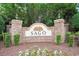 Elegant brick community entrance with the 'SAGO' name displayed amidst lush landscaping and lighting at 380 Babylon Pine Dr., Myrtle Beach, SC 29579