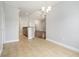 Open-concept dining room showcasing tile flooring and access to the kitchen with stone countertops at 380 Babylon Pine Dr., Myrtle Beach, SC 29579