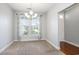Elegant dining room featuring neutral carpet, stylish curtains, and ample natural light at 380 Babylon Pine Dr., Myrtle Beach, SC 29579