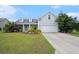 Charming single-Gathering home with a well-manicured lawn and inviting curb appeal on a sunny day at 380 Babylon Pine Dr., Myrtle Beach, SC 29579
