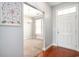 Inviting foyer leading to a dining area, featuring hardwood floors and a decorative chandelier at 380 Babylon Pine Dr., Myrtle Beach, SC 29579