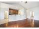 Open-concept kitchen with stainless steel appliances and a breakfast bar overlooking the living area at 380 Babylon Pine Dr., Myrtle Beach, SC 29579