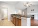 Stylish kitchen with stainless steel appliances, a breakfast bar, and an open view to the living room at 380 Babylon Pine Dr., Myrtle Beach, SC 29579