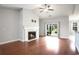 Bright living room with hardwood floors, a fireplace, and sliding glass doors to the outdoors at 380 Babylon Pine Dr., Myrtle Beach, SC 29579