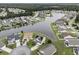 Aerial view of a neighborhood surrounding a lake with well-maintained lawns and mature trees at 388 Sea Turtle Dr., Myrtle Beach, SC 29588