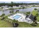 Aerial view of community pool surrounded by palm trees, lounge chairs, and lush landscaping at 388 Sea Turtle Dr., Myrtle Beach, SC 29588