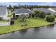 Spacious backyard with lush lawn, mature trees, and peaceful water views, ideal for outdoor relaxation at 388 Sea Turtle Dr., Myrtle Beach, SC 29588